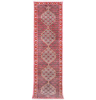 A Runner carpet, Senneh, c. 325 x 80 cm.