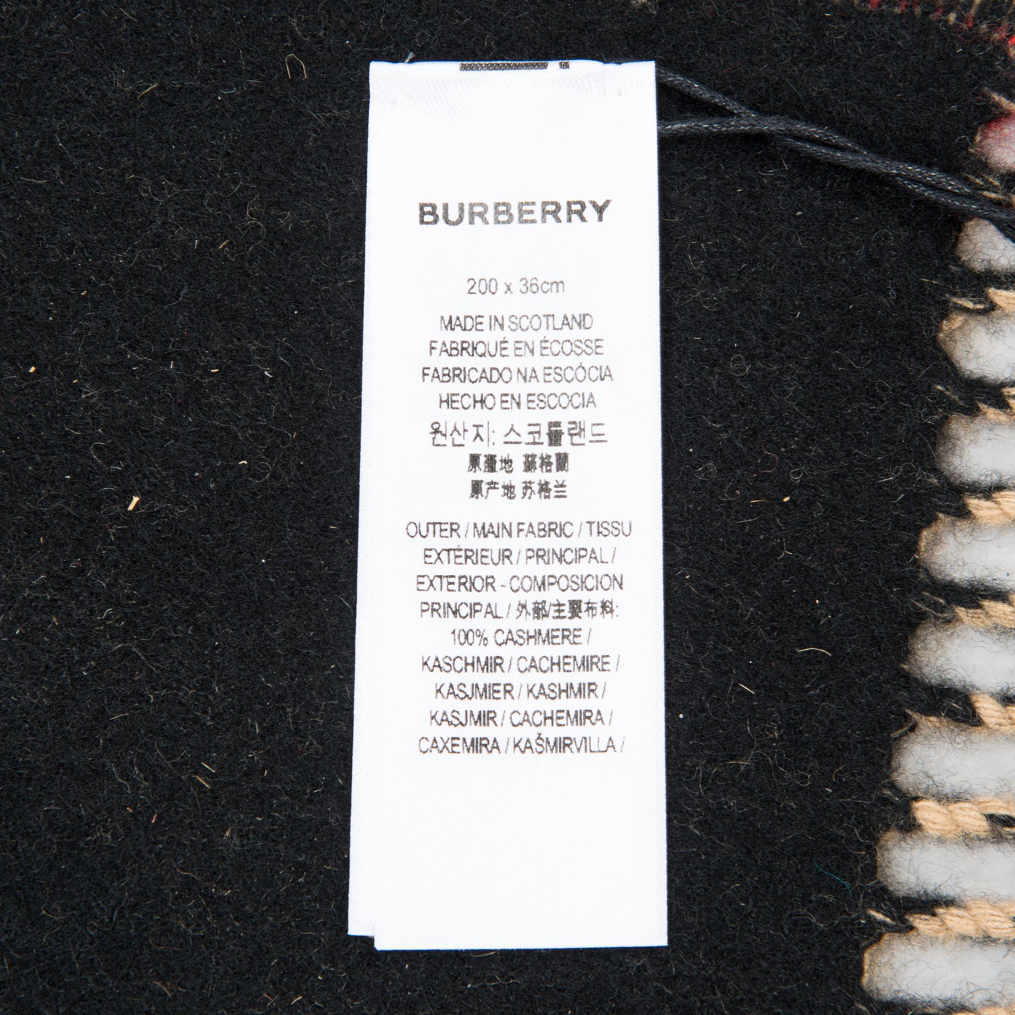 Burberry, A Icon Stripe scarf.