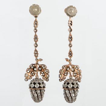 A pair of earrings set with old- and rose-cut diamonds.