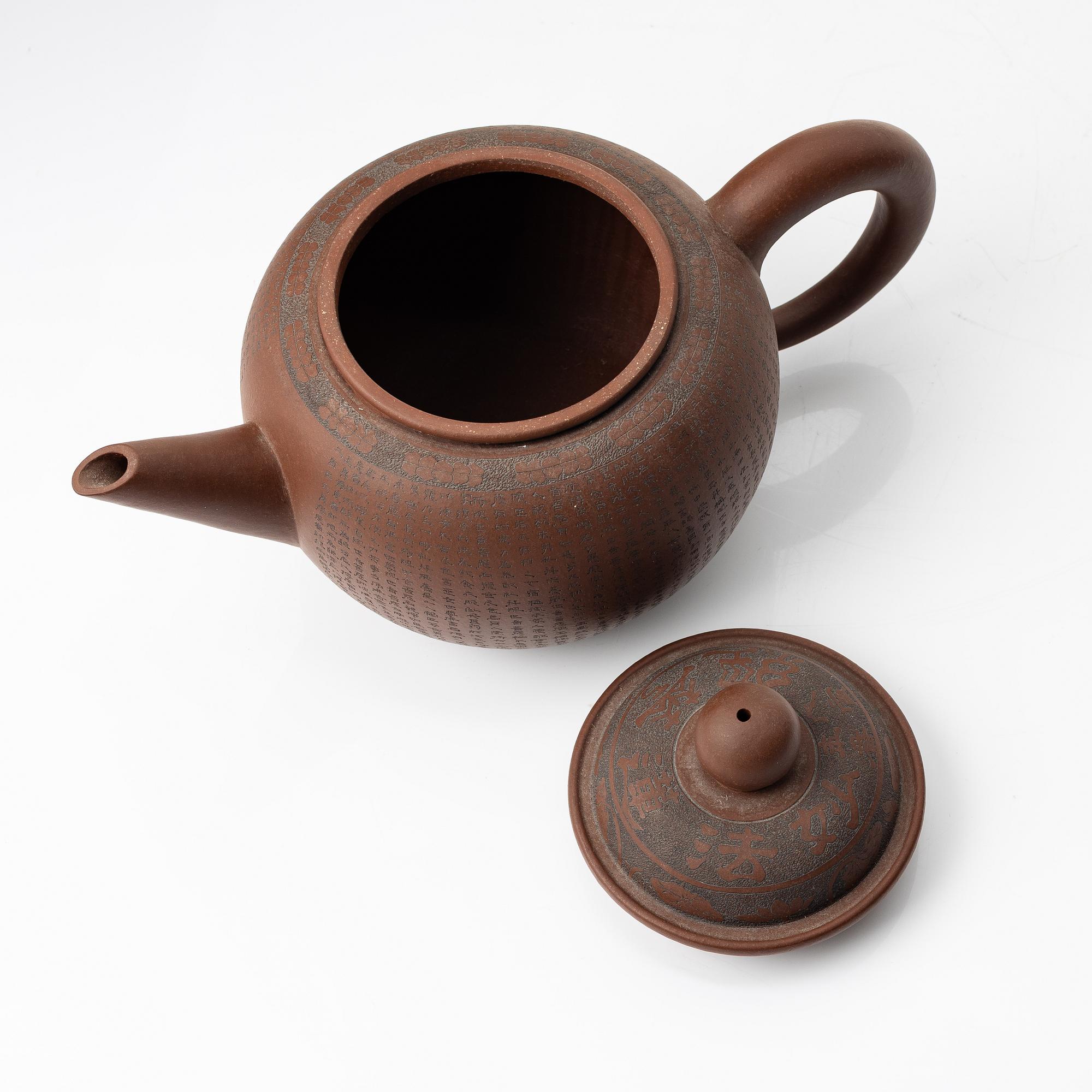 A 'calligraphy' yixing teapot, China, later part of the 1900s.