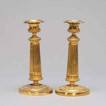 A pair of Empire-style candlesticks, ca 1900.