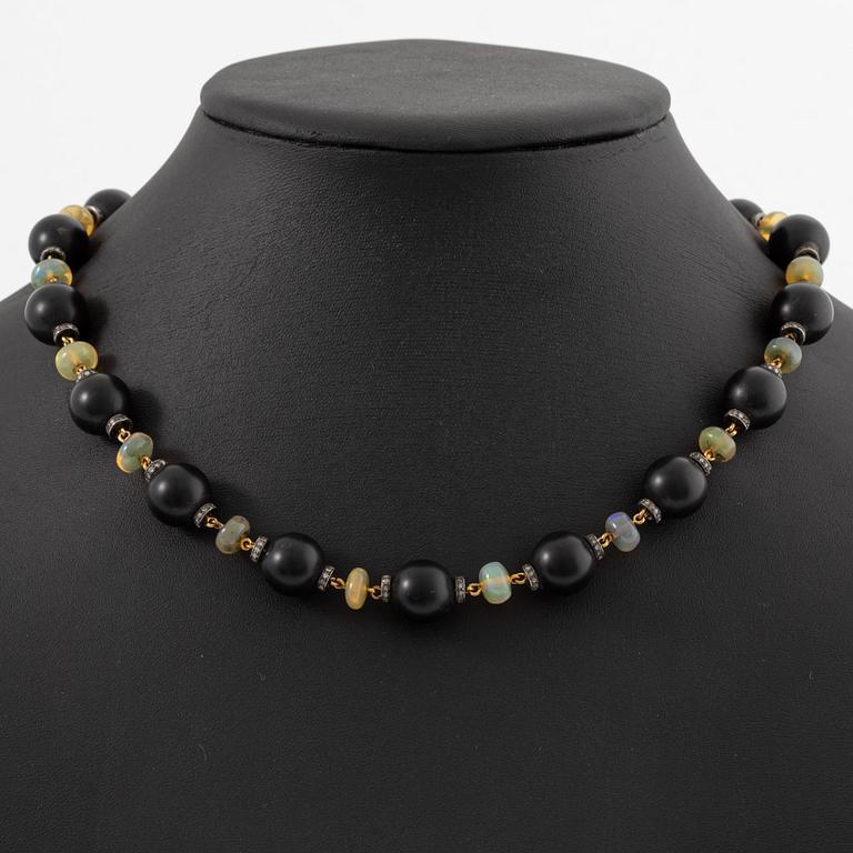 Necklace, 18K gold with onyx, opal, and diamonds.