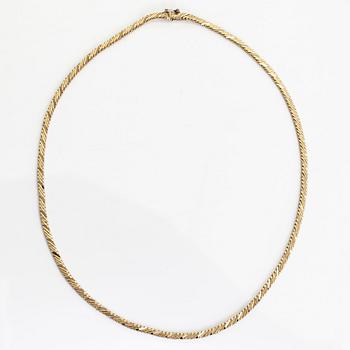 A necklace in 18K white and yellow gold.