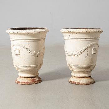 Urnor ett par gjutjärn omkring 1900.