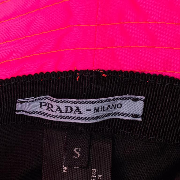 Prada, a neon pink bucket hat.