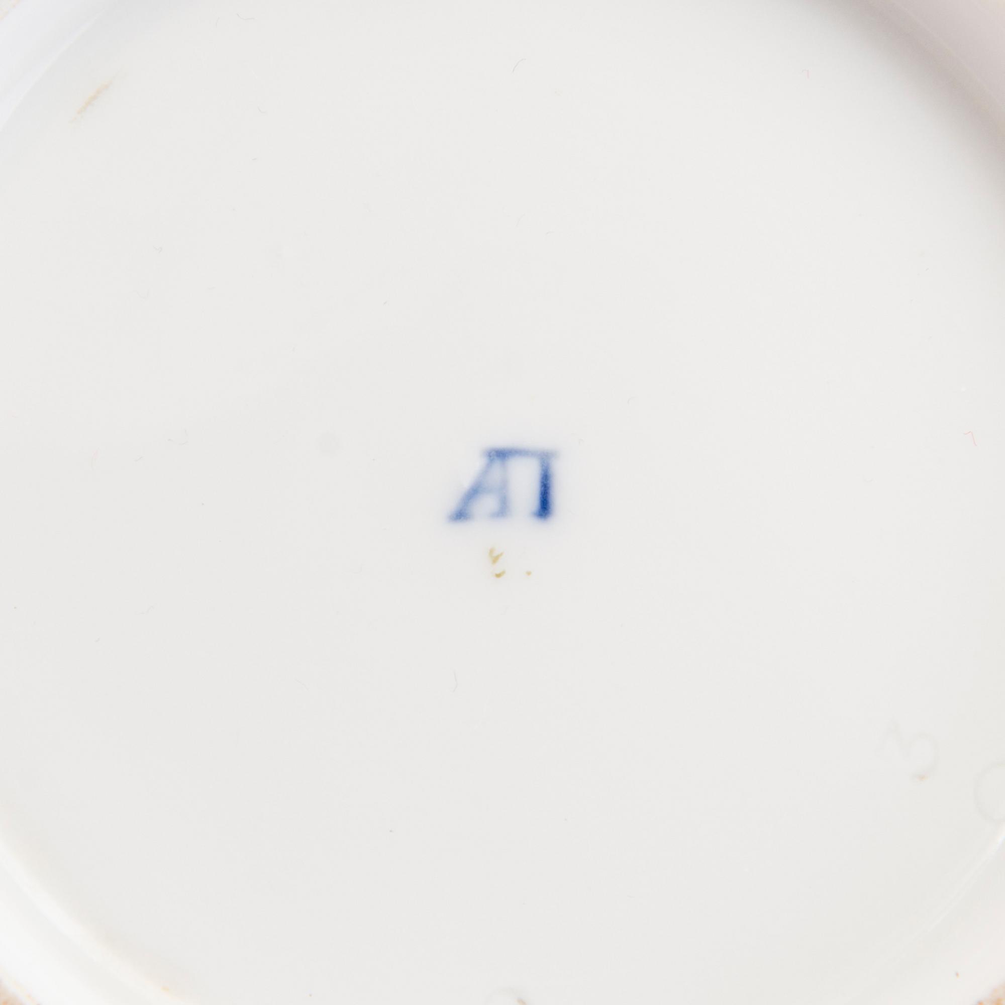 A Popov porcelain cup with saucer, Russia mid-19th Century.