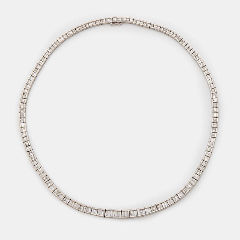 A platinum necklace set with tapered baguette-cut diamonds.