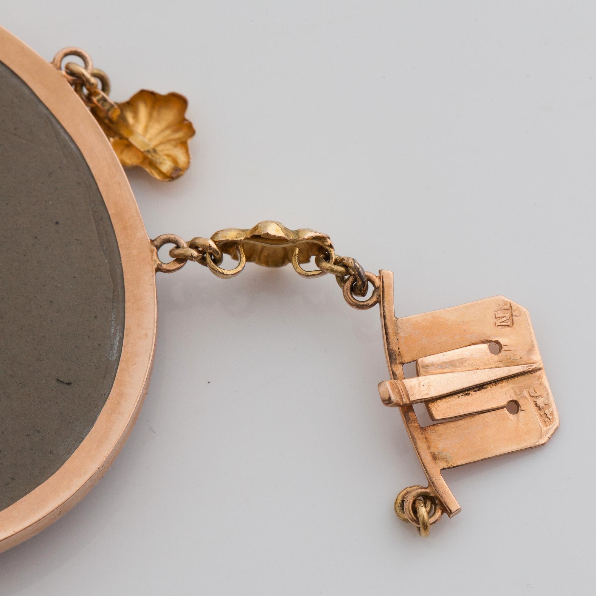 A lava cameo bracelet with antique motifs. One extra cameo included.
