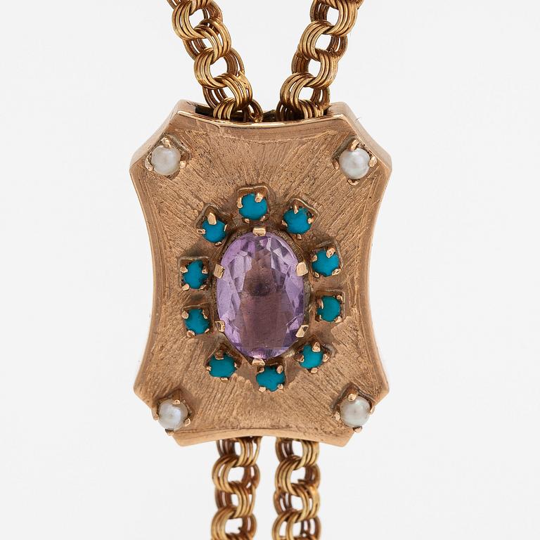 A 14K gold necklace with an amethyst, turquoises and seed pearls. Foreign marks.