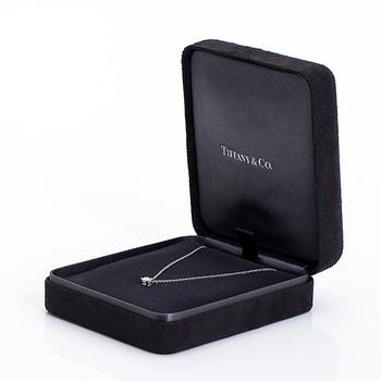 Tiffany & Co, riipus ketjulla, platinaa ja  timantti n. 0.23 ct. Sertifikaatilla.