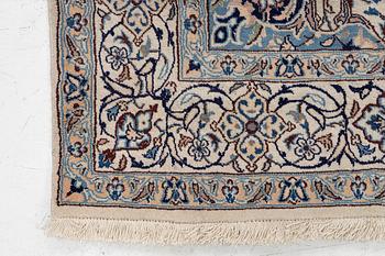 A Nain carpet, c. 310 x 195 cm.