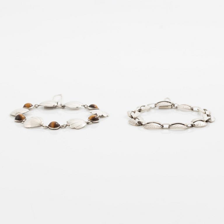 Victor Janson, two silver bracelets, one set with tiger's eye.