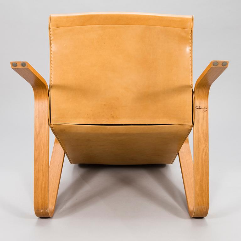 EERO SAARINEN, a 'Grasshopper' armchar and ottoman manufactured under licens by Tetrimäki Finland.