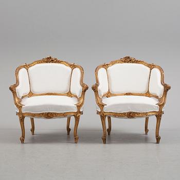 A pair of 20th century easy chairs.