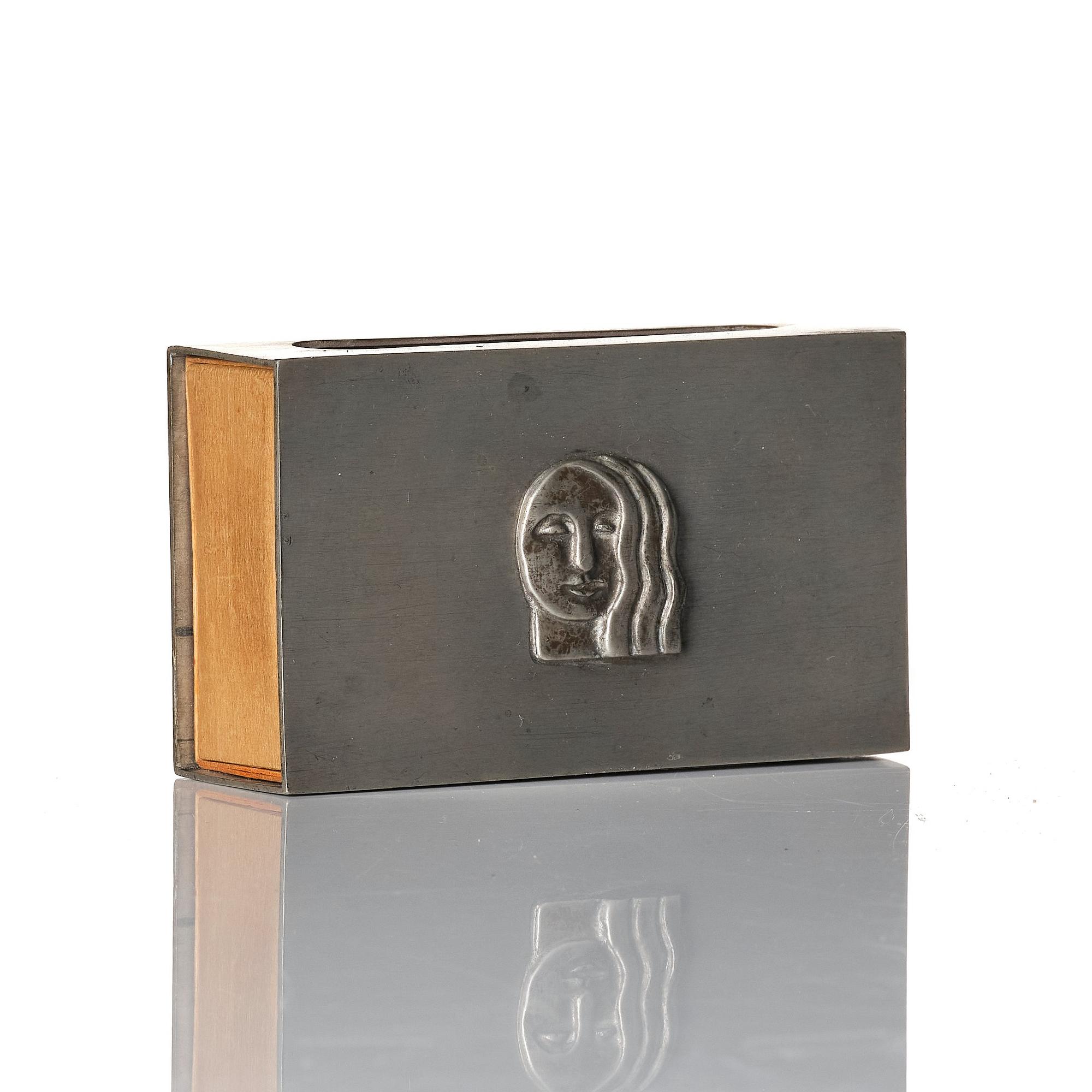 Firma Svenskt Tenn, a pewter matchbox case with beaker, models "38d" and "185a", with decor by Anna Petrus, Stockholm 1927-28.