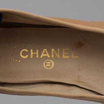 Ballerina shoes by Chanel.