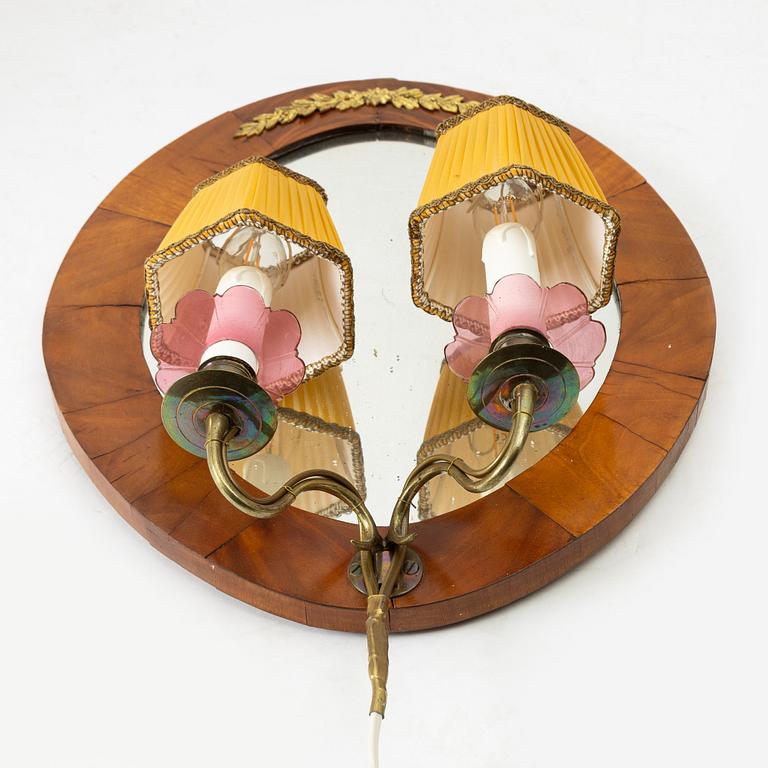 A pair of Swedish Empire mirror sconces, first half of the 19th century.
