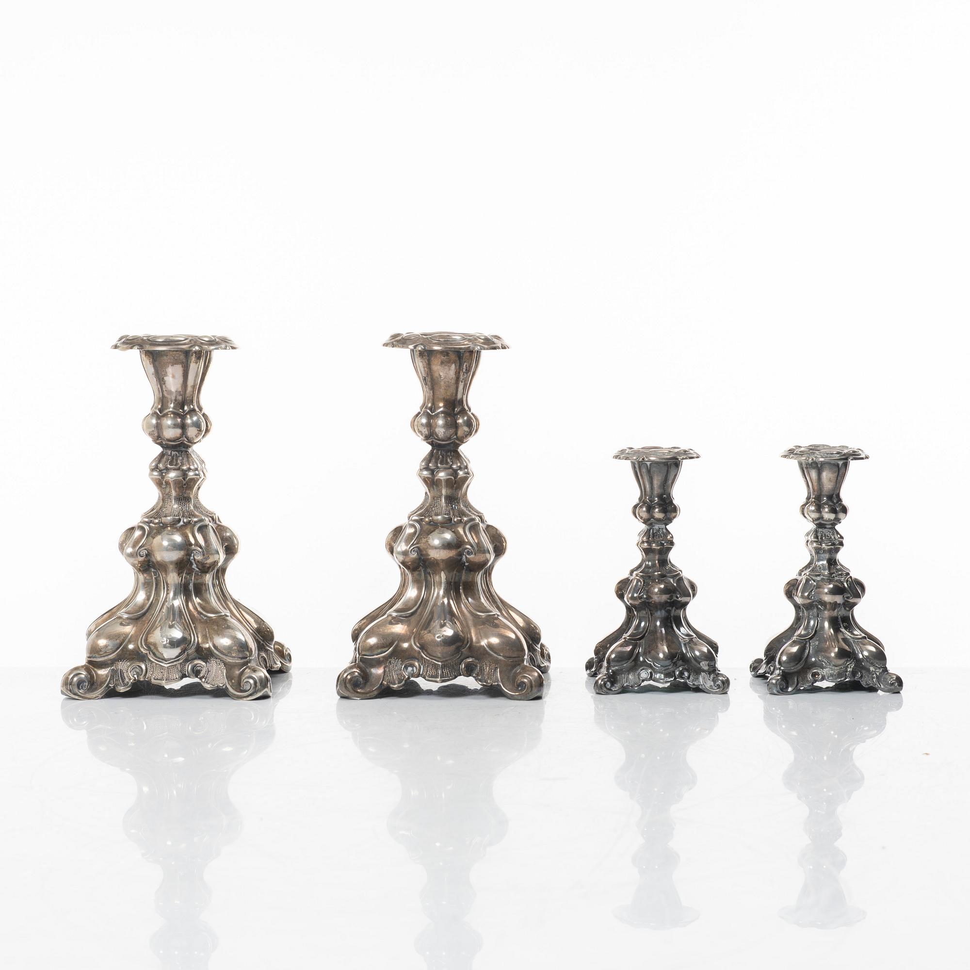 Four Baroque style silver candlesticks, 20th century.