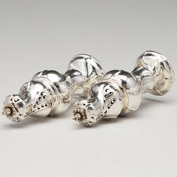 A matched pair of Swedish Rokoko silver sugar-casters, one marked Olof Gravander, Kristinehamn 1764, one a later copie.
