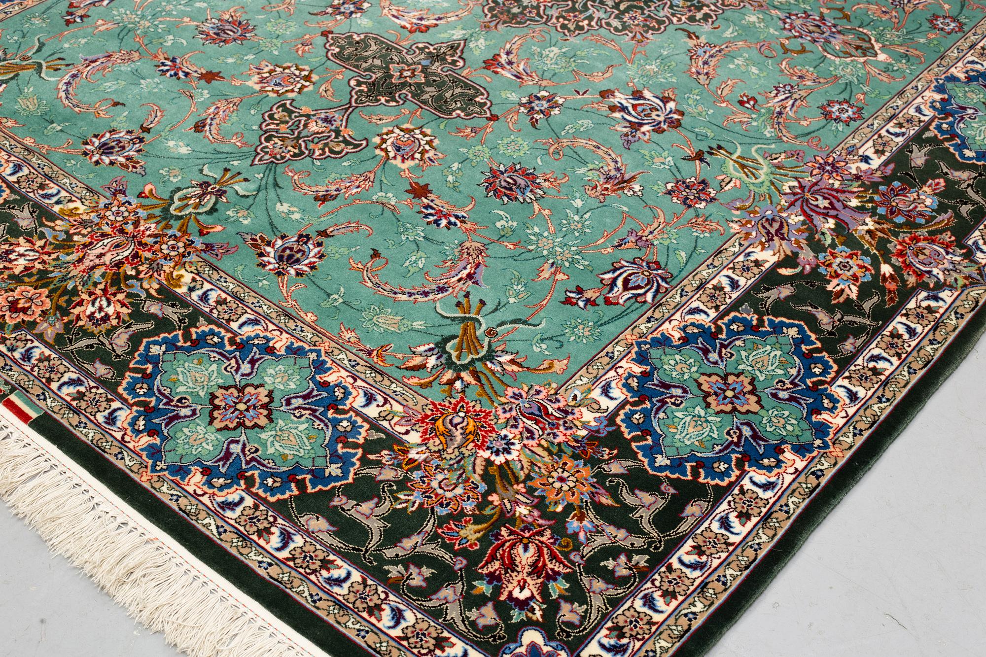 A rug, old Esfahan, part silk, signed, ca 225 x 149 cm (ca 1,5-2,5 cm flat weave at the ends).