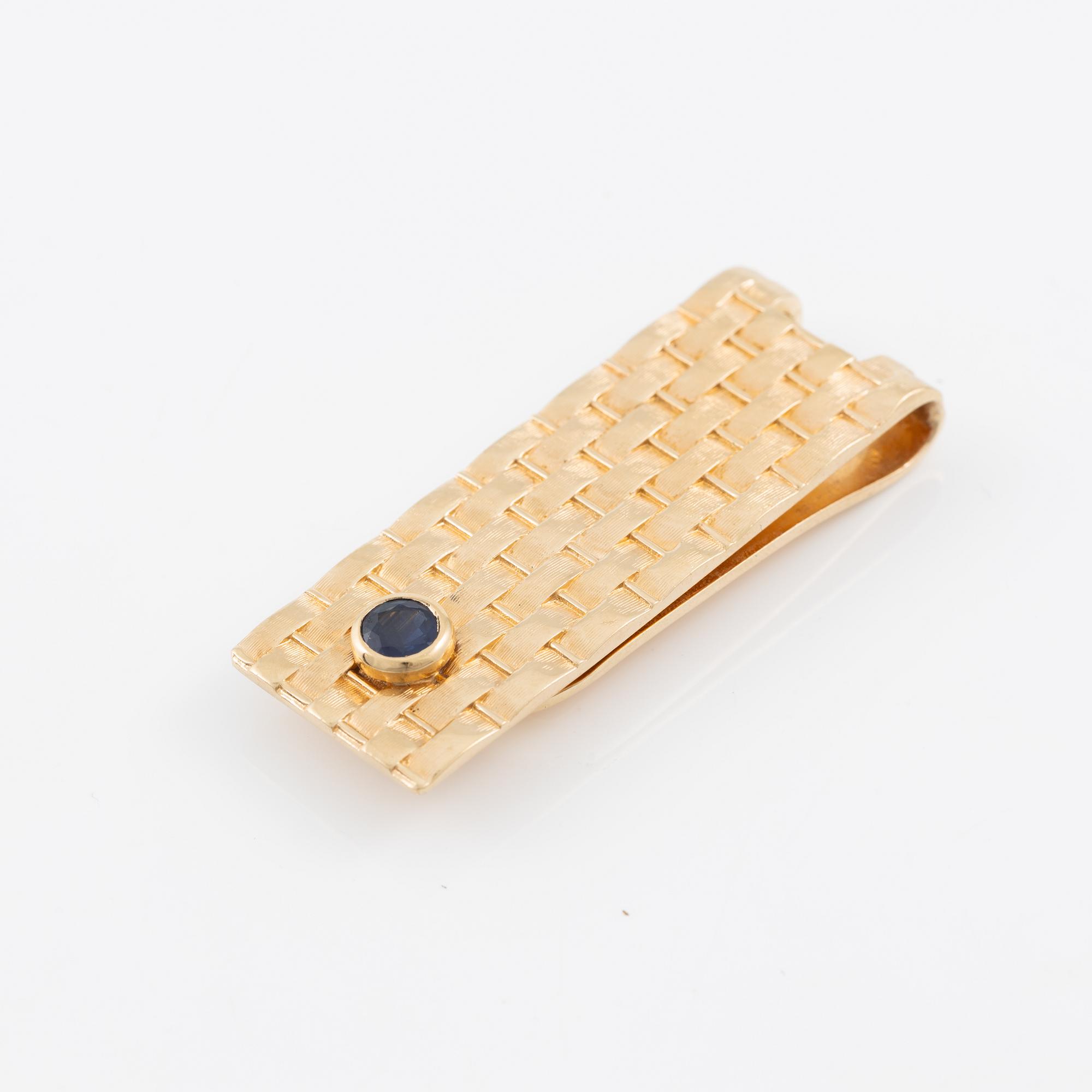 Billfold, 14K gold with sapphire.