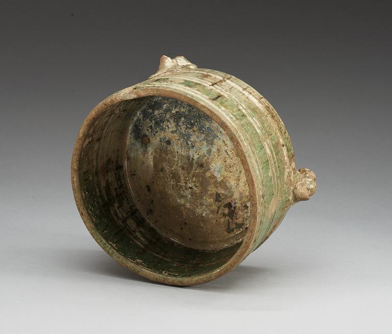 A green glazed tripod censer, Han dynasty (206 BC – 220 AD).