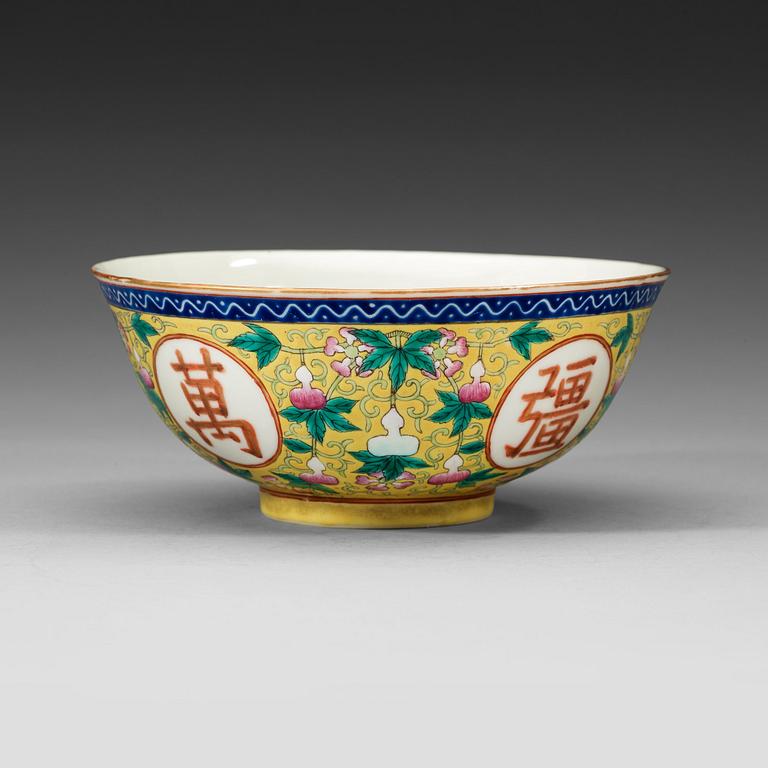 A famille rose yellow ground bowl, Qing dynasty, Guangxu six-character mark and of the period  (1875-1908).