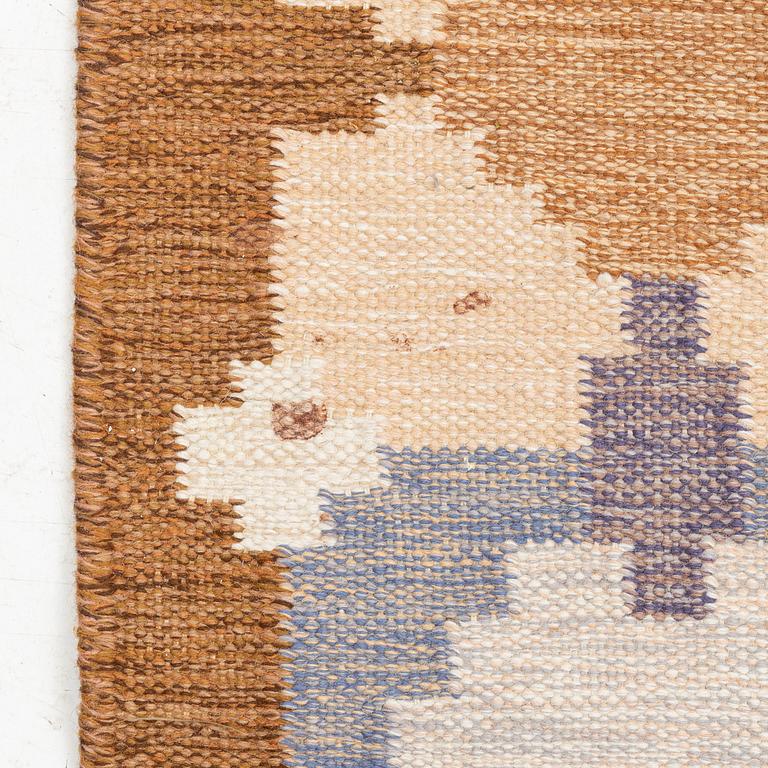 A flat weave rug, signed GG, c. 235 x 170 cm.