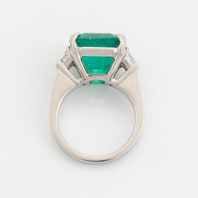 Emerald and trapezoid cut diamond ring.