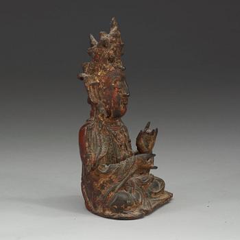 A bronze figure of a sitting Guanyin, Ming dynasty (1368-1644).