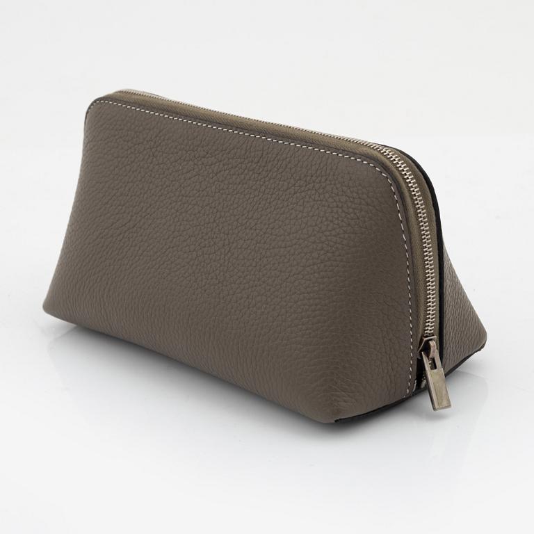 Céline, A small cosmetic pouch in beige leather.