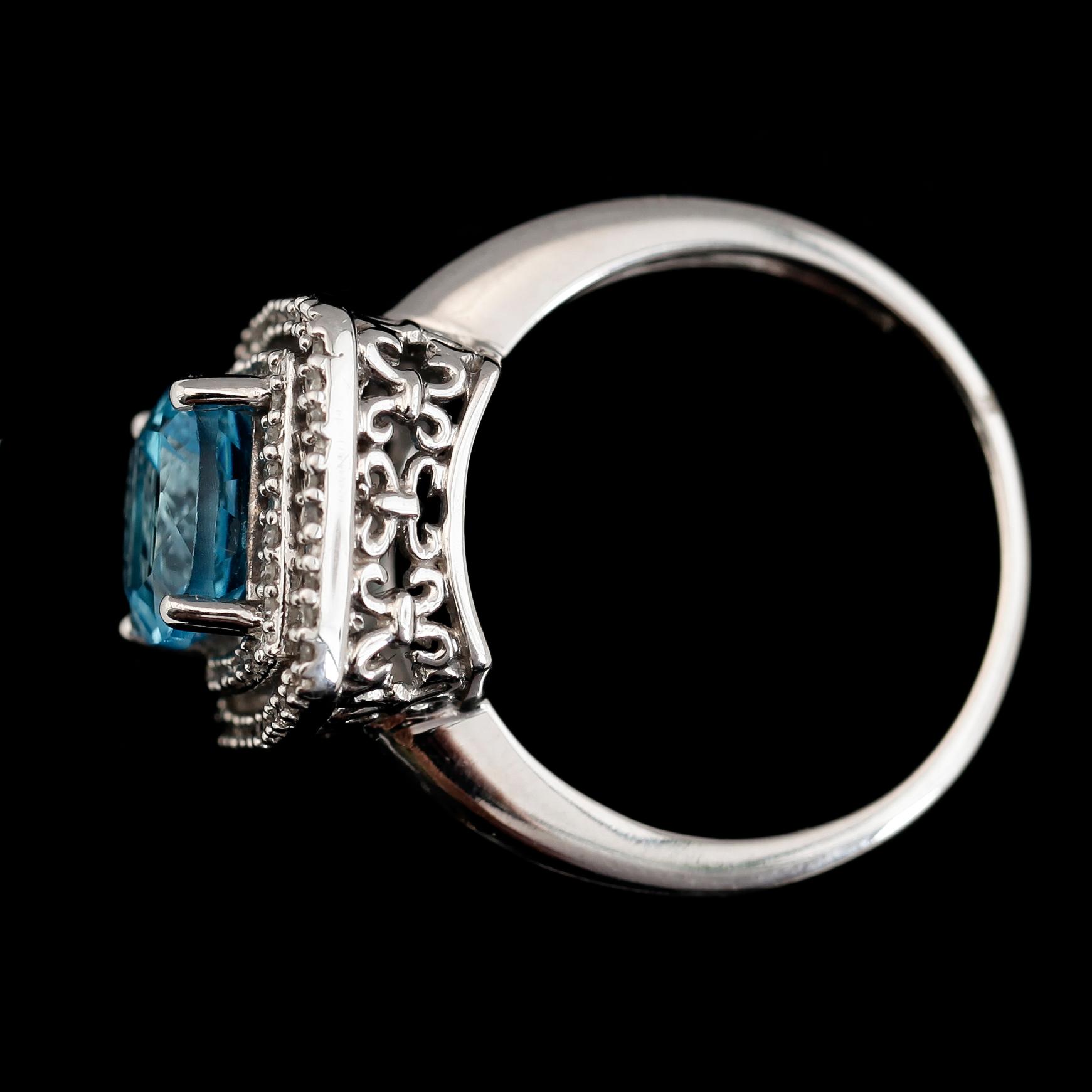 RING, 14K vitguld, diamanter tot ca 0.17 ct och topas. Total vikt ca 5 g.