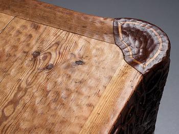 Gustaf Fjaestad, an Art Nouveau carved pine table, Arvika Sweden 1914, a double to the table in the Thiel Collection,