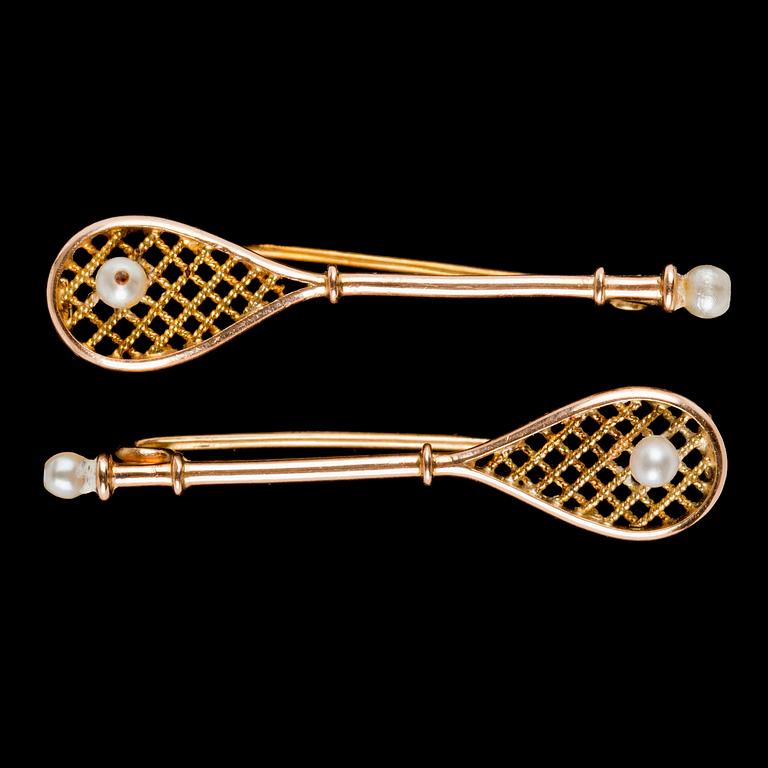 A pair of tennis rack brooches, early 20th century.