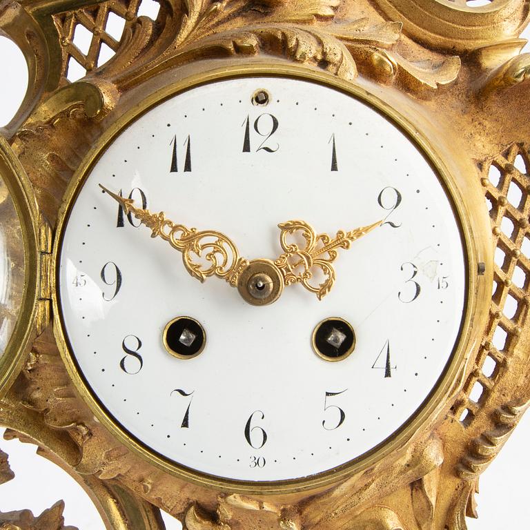 A gilde metal Lous XV style wall clock.