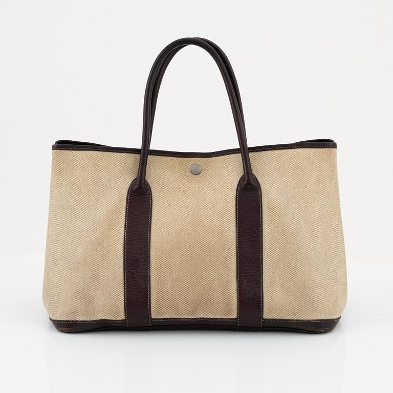 Hermès, a canvas and brown leather 'Garden Party' bag.