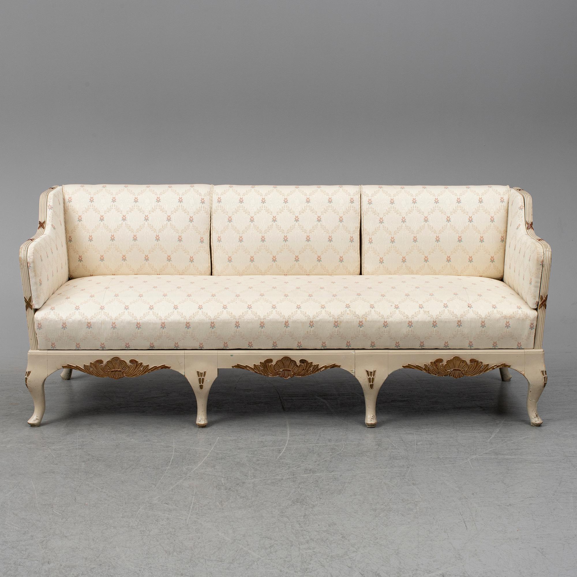 An early 20th century rococo revival sofa.