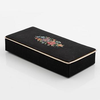 Necklace with matching earrings, white metal in floral design with glass stones.