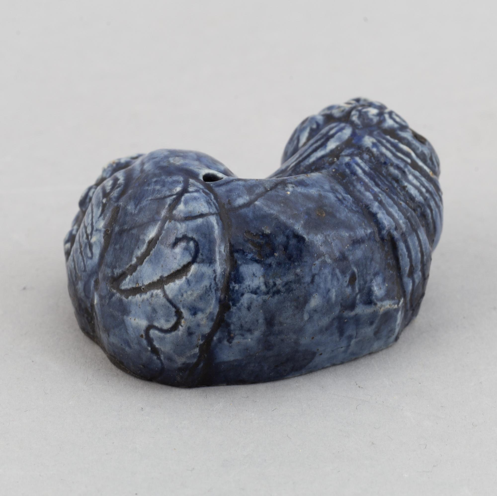 A blue glazed figure of a buddhist lion, Qing dynasty, Qianlong (1736-95).