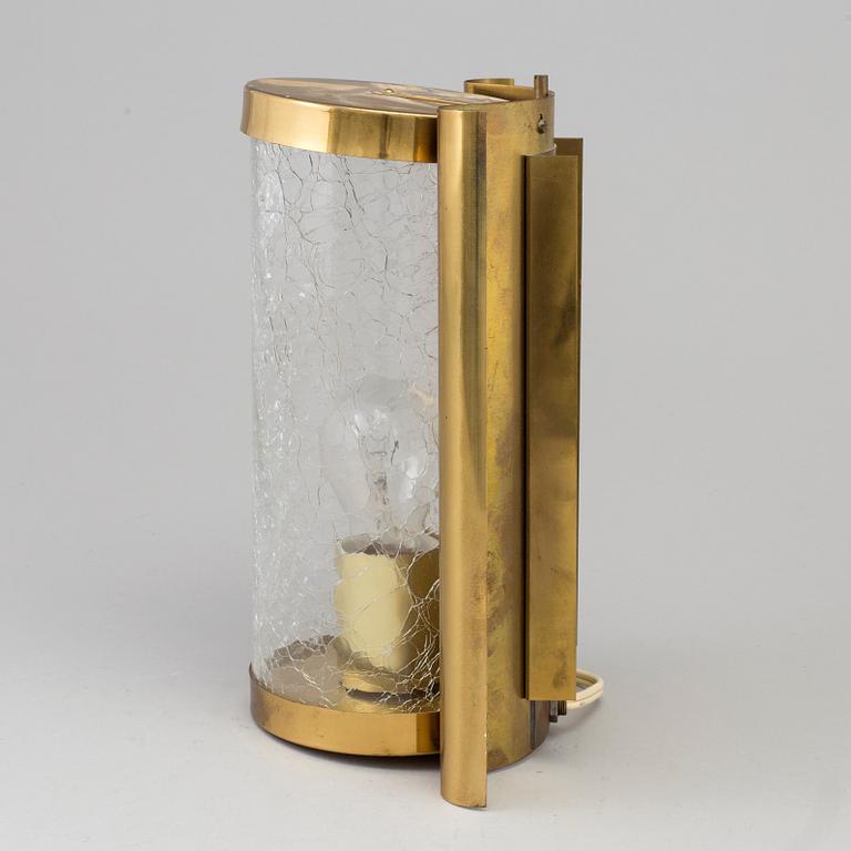 A WALL-LIGHT, brass and glass, probably 1970s.