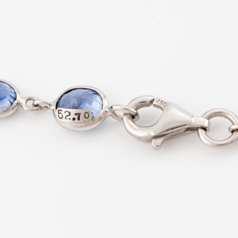 An 18K white gold necklace set  with faceted sapphires.