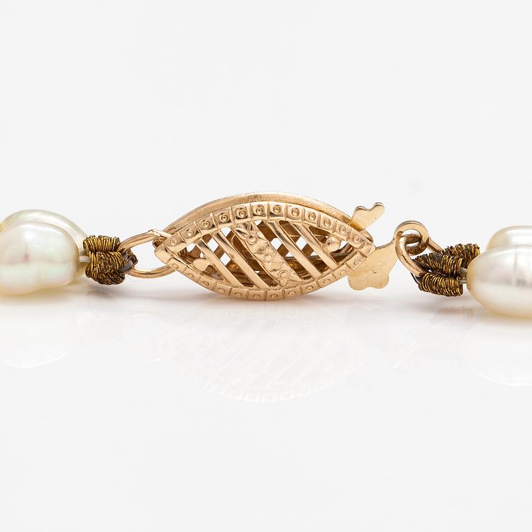 A two-strand pearl collier with cultured pearls and 14K gold clasp.