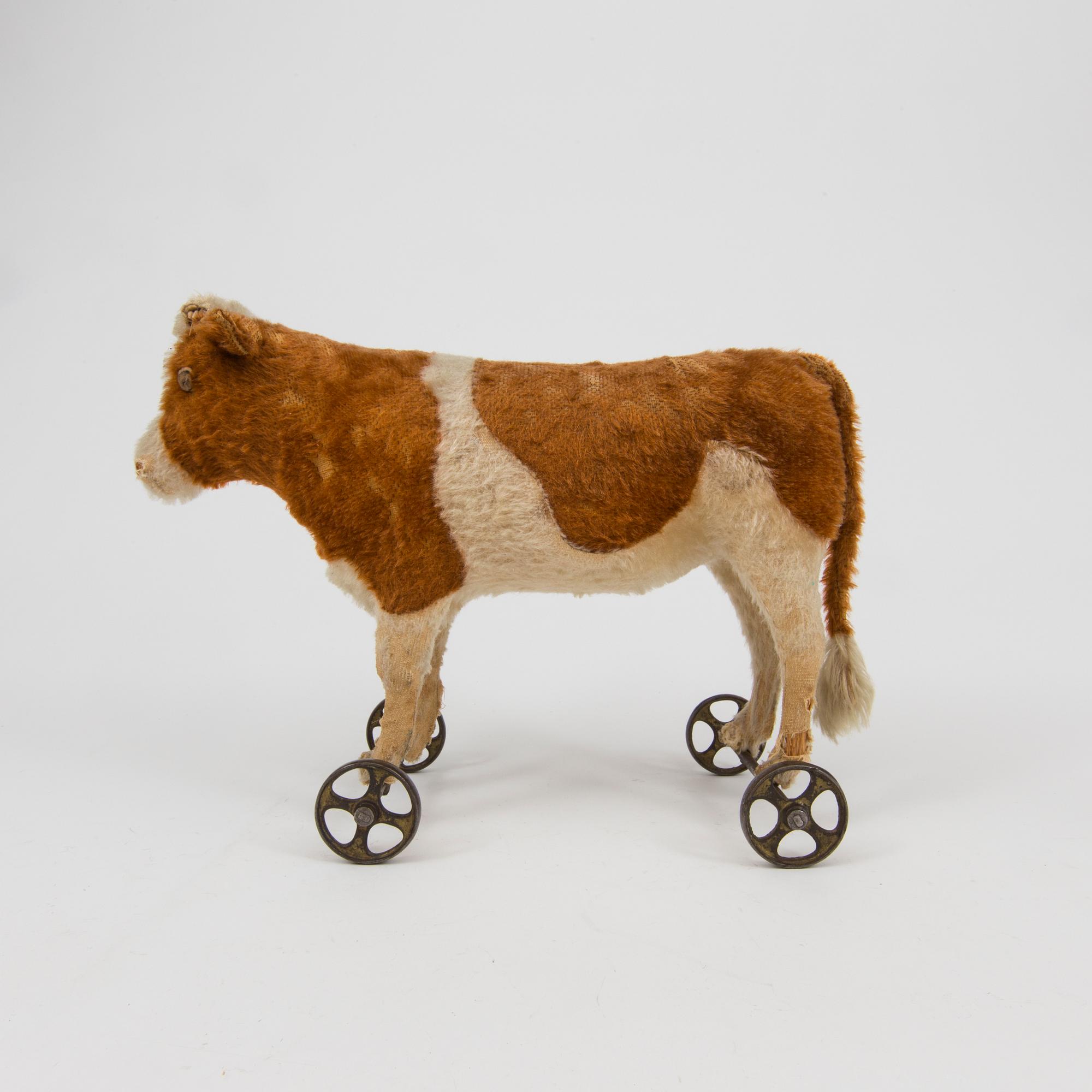 A Steiff cow and a Schuco A Steiff cow and a Schuco