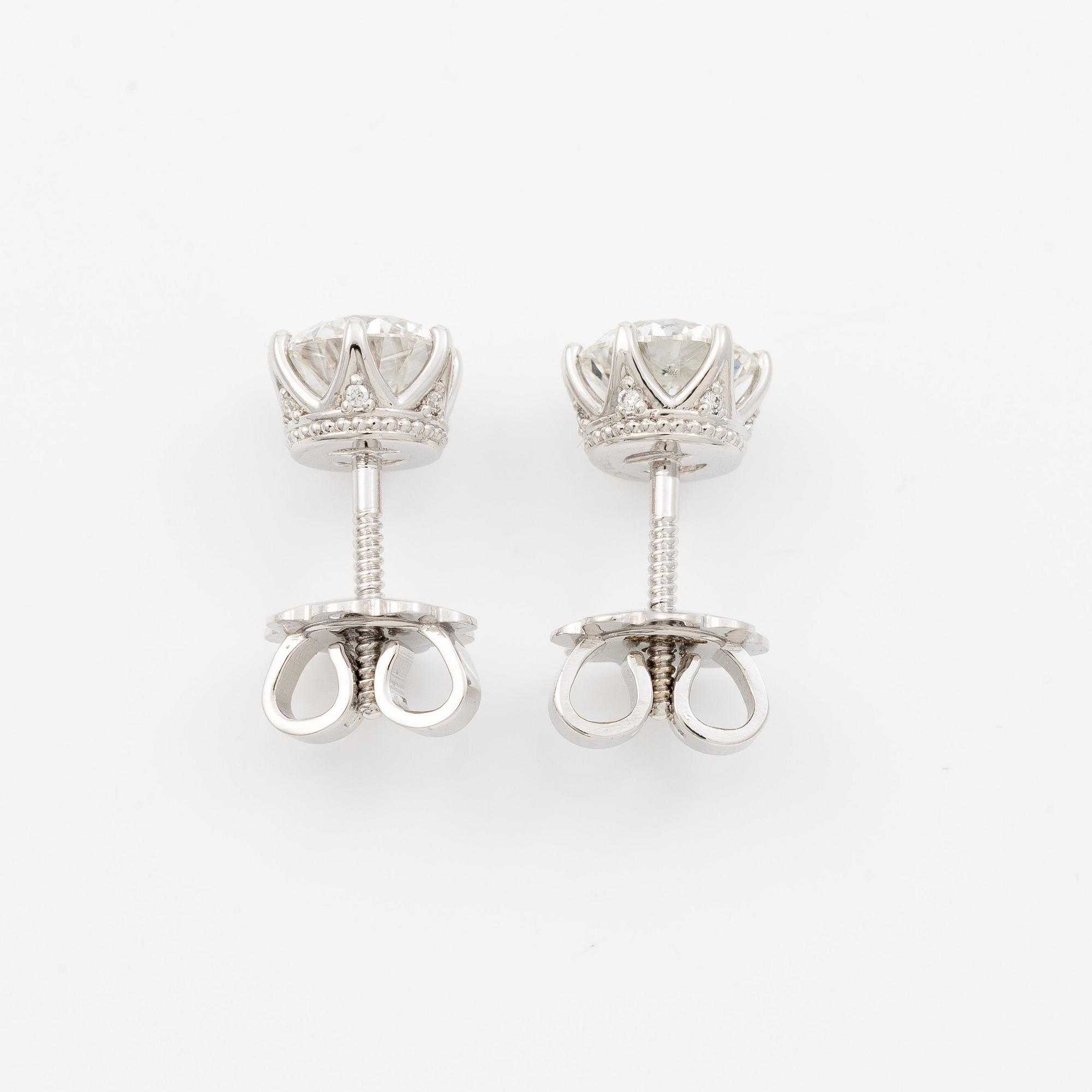 Earrings, single-stone earrings in 18K white gold with brilliant-cut diamonds, accompanied by IGI report.