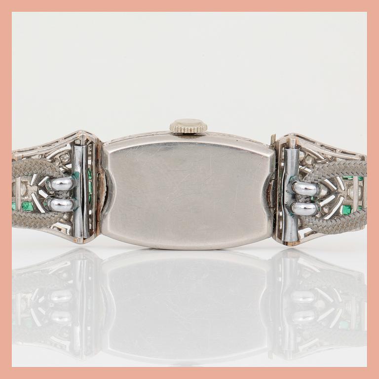 ARMBANDSUR, Art Deco, silver med åttkantslipade diamanter, tot ca 0,74 ct och smaragder. Total vikt ca 15 g.