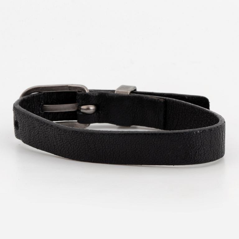 CHANEL, a leather bracelet.