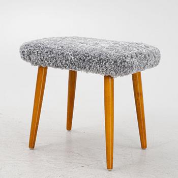 A sheepskin upholstered stool, second part of the 20th century.