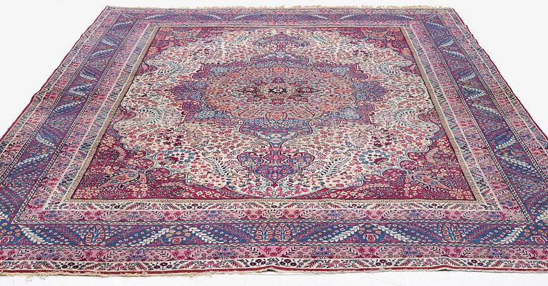 A semi-antique Kirman carpet, South Persia, c. 380 x 289 cm.