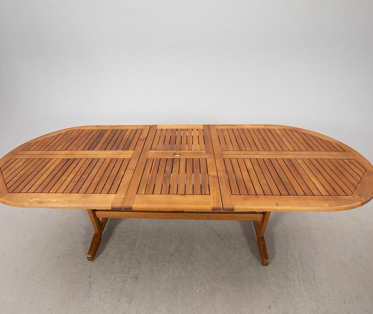 A 9 pcs stained teak garden suite by Brafab around 2000.
