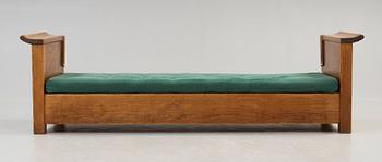 An Axel Einar Hjorth stained pine sofa 'Sandhamn', by Nordiska Kompaniet ca 1929.